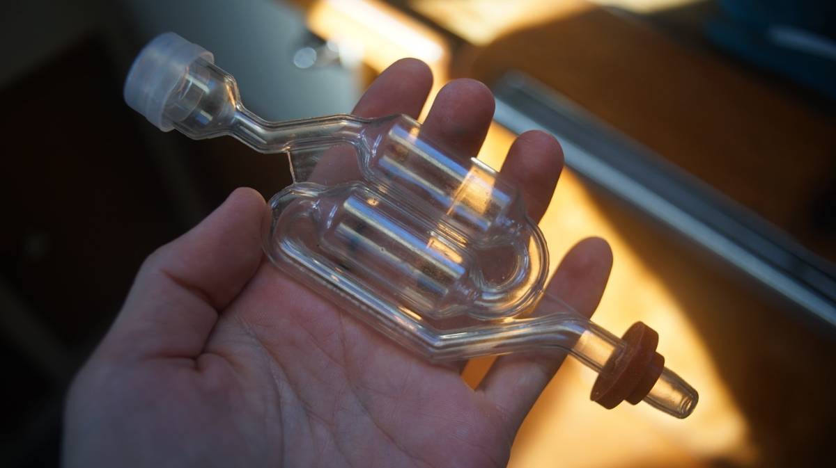 a hand holding an airlock