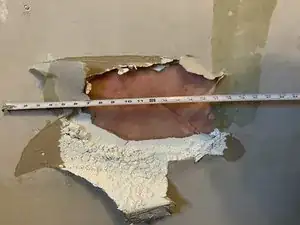 How to Repair a Large Wall Hole Using Drywall