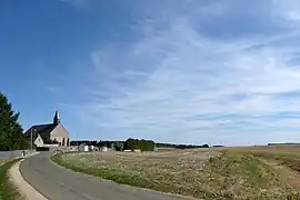 The church and surroundings in Saint-Arnoult-des-Bois