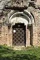 Romanesque portal of rotunda with exterior fresco