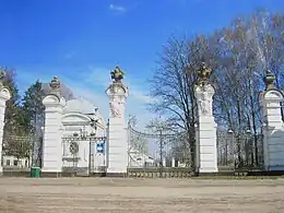 The palace gates with the coat of arms of the Sanguszko and Potocki families