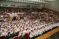 Members of the school assembled in the auditorium on its 75th anniversary.