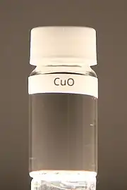 Copper(II) oxide in a vial