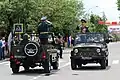 Military parade in South Ossetia: flags visible on licence plates and on bunting