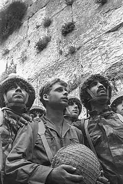 Image 5Paratroopers at the Western Wall, an iconic photograph taken on June 7, 1967 by David Rubinger.