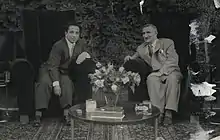 Photograph of Mustafa Al-Umari and King Faisal II sitting in armchairs