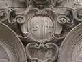 The arms of the hospital, on the chapel wall, carved by  Pere Costa