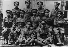 Black-and-white photo of a group of men in military uniform