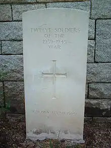 Headstone for 12 unknown soldiers who fell in the war at Stanley Military Cemetery.