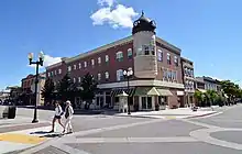 The entirely rebuilt clock tower stands downtown neighboring the city park.