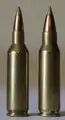 .17 Remington Fireball cartridge next to a .221 Remington Fireball cartridge, its parent case