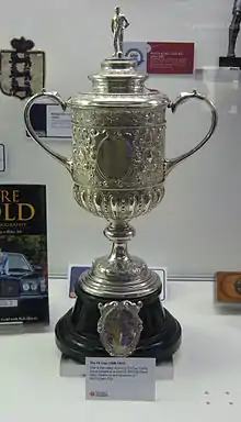 The trophy, silver in colour and topped by a figure of a footballer, on an ebony plinth