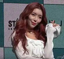 Dawon in white shirt and posing for the camera in January 2019