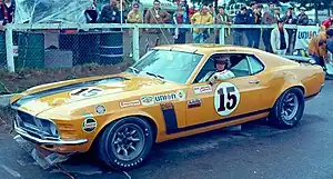 Parnelli Jones sitting in 1970 Boss 302 Mustang