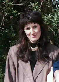 Young woman in Europe wearing a jacket with shoulder pads, 1985.