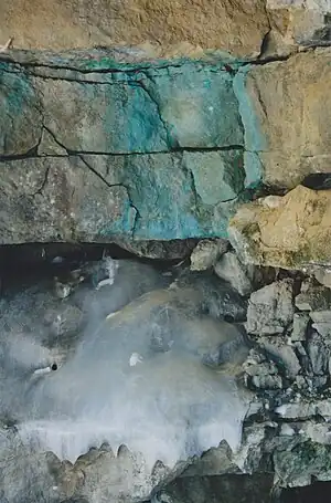 Rock face (Frost weathering) and downstream exit of the stream (Unnamed)