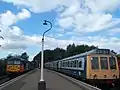 A Rail Blue and Grey liveried three car Class 117 DMU at Peterborough Nene Valley railway station on the preserved, heritage Nene Valley Railway.