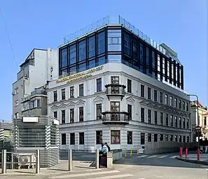 Facadism - Strada Olteni no. 1, Bucharest, one of the few buildings that remained in the area behind Unirea Shopping Center after the massive demolitions from the mid and late-1980s, with its interior and height changed. The only original element remains the facade