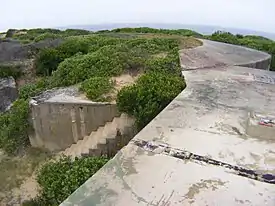 A partially buried gun emplacement that formed part of Fort Banks