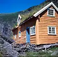 2001. Main building at Sinjarheim has been clad with timber boards and painted by voluntary communal work to preserve historically significant structures.