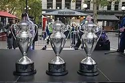 Three silver trophies on display