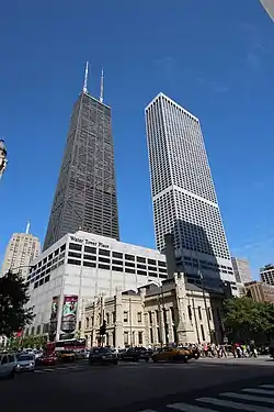 View of Water Tower Place (mall on left, skyscraper on right), with Chicago Avenue Pumping Station in foreground, John Hancock Center in background