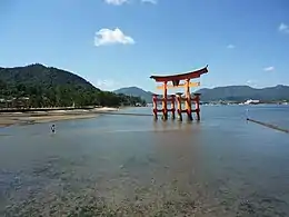 The torii with a visitor and view of the Seto Inland Sea