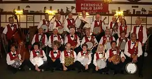 Peninsula Banjo BandAugust 28, 2013Top Row, left to right: Sam Morocco, Bill Lundgren, Jim Strickland, Gordon Ashby, Don Brayton, John Krakar, John Lathrop, Ray Buhler, Mary Horne, Charlie Tagawa.Middle Row: Rich Boss, Ralph D'Avolio, Barbara Fiedler, Cliff Tranberg, Adrienne Griffin, Bob Lasley.Bottom Row: Jean Avram, Gaylen George, Betty Jean Miller, Dave Marty, Joan Goldstein, Joyce Taylor, Jimmie Min