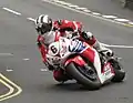 2013 Isle of Man TT Superbike Race Lap 6 – Michael Dunlop (6) 1000cc Honda Parliament Square, Ramsey 2 June 2013.