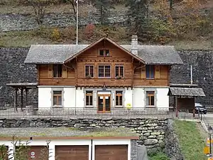 Two-story wooden building with gabled roof