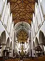 Looking east from underneath the pipe organ down the central nave