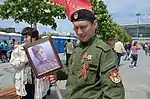 Sparta Battalion soldier wears an EMR uniform and a Ribbon of Saint George during the 2016 Victory Day parade in Donetsk.