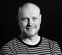 A black and white photo of Jonathan Barnbrook