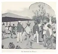 Photo of many people at a market