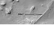 Possible dike in Thaumasia, as seen by HiRISE under HiWish program.  Dikes may have deposited valuable minerals.