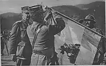 Allied commander-in-chief Louis Franchet d'Espèrey decorates the battle flag of the 5th Archipelago Regiment in June 1918, with commander Dimitrios Ioannou to his left