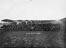 25th AS & Royal Aircraft Factory S.E.5 aircraft. Landis center w/mascot (dog)