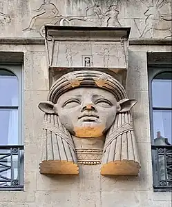 Egyptian Revival mascaron with the face of goddess Hathor on the facade of the Foire du Caire building (Place du Caire no. 2), Paris, unknown architect, 1828