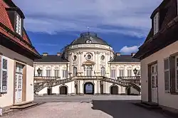 The corps de logis seen from the southwest. On either side of the image are parts of the other two buildings of Solitude's complex.