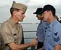 Jay L. Johnson and crewmember aboard USS Harry W. Hill on 24 December 1997