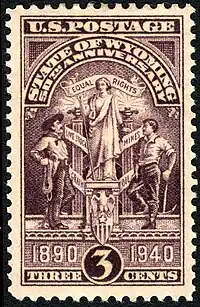 Image 5On July 10, 1940, the U.S. Post Office issued a postage stamp commemorating the 50th anniversary of Wyoming statehood. The engraving depicts the Wyoming state seal, which features a central figure of a woman in front of a banner reading 'equal rights' (from Wyoming)