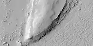 Close view of layers from previous image, as seen by HiRISE under HiWish program. Some dark slope streaks are visible.