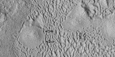 Brain terrain being formed, as seen by HiRISE under HiWish program Note: this is an enlargement of a previous image using HiView.  Arrows indicate spots where brain terrain is beginning to form.