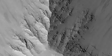 Close view of layers in Louros Valles, as seen by HiRISE under HiWish program  Note this is an enlargement of a previous image.