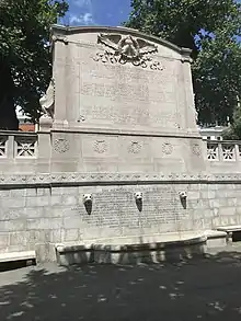 Photo of inscription which reads : "To the 54th Regiment of the Massachusetts Infantry The White officers taking life and honor in their hands cast in their lot with men of a despised race unproved in war and risked death as inciters of servile insurrection if taken prisoners besides encountering all the common perils of camp march and battle. The Black rank and file, volunteered when disaster clouded the Union cause served without pay for 18 months till given that of white troops faced threatened enslavement if captured were brave in action patient under heavy and dangerous labors and cheerful amid hardship and privations. Together, the gave to the nation and the world undying proof that Americans of African descent possess the pride courage and devotion of the patriot soldier, 180,000 such Americans enlisted under the union flag in MDCCCLXIII–MDCCCLXV. The memory of the just is blessed" then the names of the regiments.