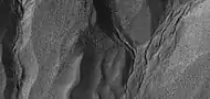 Close view of gullies, as seen by HiRISE under HiWish program Polygonal shapes are visible.