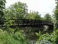 A pedestrian bridge of the Lansing River Trail at Riverpoint Park.