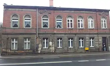 Facade with faded writings in German and Polish