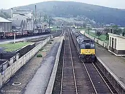 A class 24 arrives at Rothes with a train for Aberdeen in May 1968