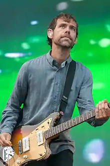 Man playing a guitar on stage